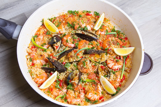 Paella with shrimps and mussels. Traditional Spanish dish