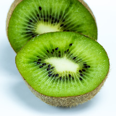 Fototapeta na wymiar Juicy kiwi fruit sliced on white