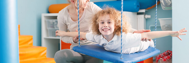 Child on therapy swing