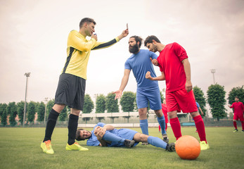 Referee showing the yellow card