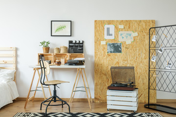 Room with desk and osb board