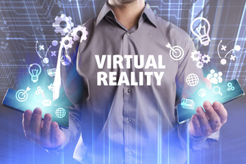 Business, Technology, Internet and network concept. Young businessman working on a virtual screen of the future and sees the inscription: Virtual reality