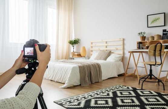 Blogger Taking A Photo Of Bedroom