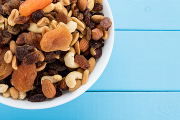 Assorted nuts and dry fruit in white bowl