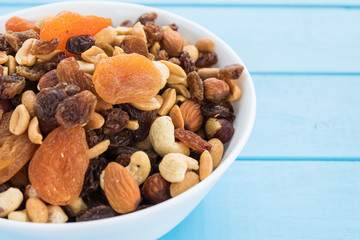 Assorted nuts and dry fruit in white bowl