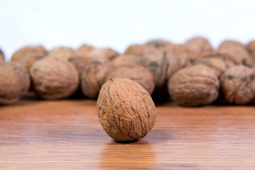 A lot of scattered walnuts close-up. A useful product.