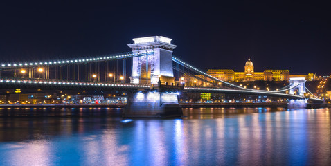 Fototapeta na wymiar Night view of the Chain Bridge (Lions Bridge) reflected in the Danube river, Budapest city center, Hungary