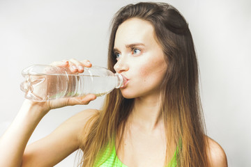 Healthy woman drinks water