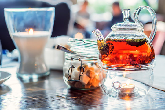 Modern Glassy Teapot With Fresh Tea