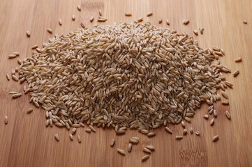 Oat grains on wooden rattan bamboo table