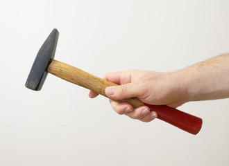Hand holding hammer
