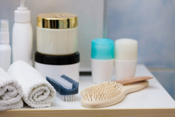 Fototapeta na wymiar Bathroom objects. Sponges, brushes, towels and creams