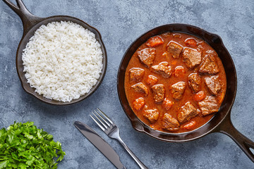 Goulash traditional homemade European beef meat stew soup food cooked with spicy gravy sauce in...