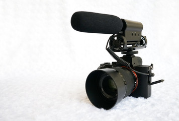 Professional mirrorless digital video camera with shotgun microphone