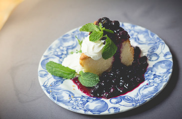 Blueberry cake with blueberry sauce. homemade blueberry cake with whipped cream