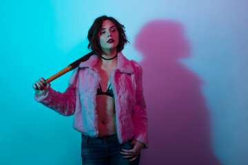 Fashionable girl with bat