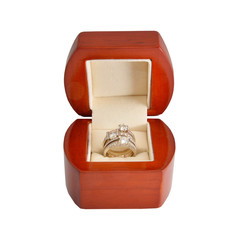 the gold ring with diamonds in the wooden box
