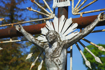 the crucifixion of Jesus Christ as a symbol of God's love (Old metal statue)