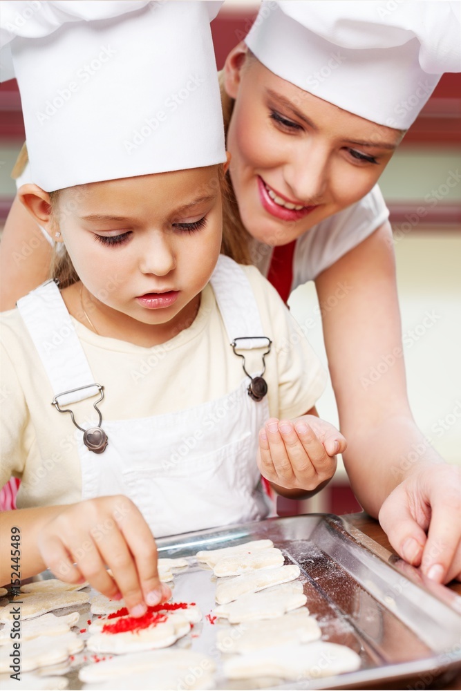 Canvas Prints Woman and child coocking.