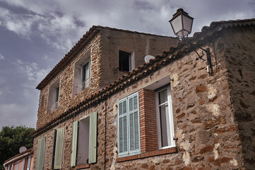Fototapeta na wymiar Windows of a stone house in Provence, France.