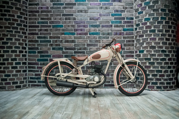 Motorcycle on a brick wall background. Details of the bike
