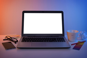 Fototapeta premium Colorful workplace - laptop computer with blank screen