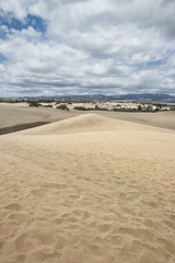 Vertical shot towards inland, of the unusual sand formations, the Maspalomas Dunes, a popular landmark and tourist attraction in Gran Canaria, Spain
