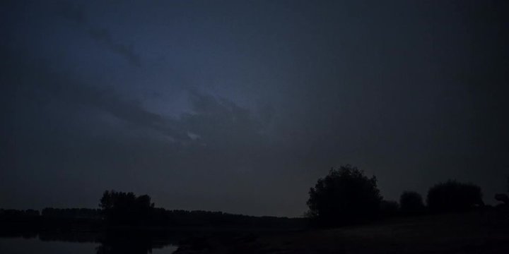 thunderstorm on the water at night with a lot of flashes