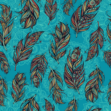 seamless pattern with tribal feathers and mandala
