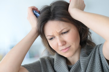 Fototapeta premium Young woman with a headache