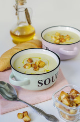 Two Bowls of vegetable soup. Cauliflower soup puree with croutons.