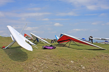 Hang gliders prepared to launch