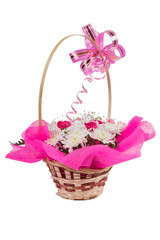 Bouquet of flowers in a basket on isolated white background
