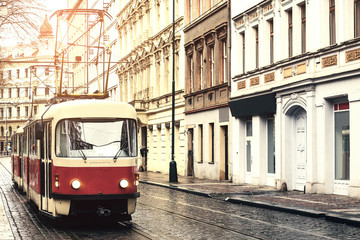 Fototapeta na wymiar Tram public transport on the street. Daily life in the city. Everyday life in Europe. Vintage style.