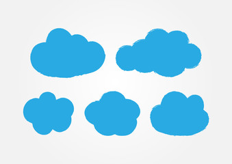 Grunge stickers in the form of clouds. Set of five blue icons painted with a brush.