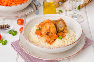 Fish stewed in tomato sauce with vegetables