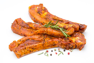 Spicy marinated spare ribs barbecued on the white background.