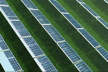 3D illustration Solar energy concept. Solar panels on grass. Blue sky reflection on photovoltaic panel. Power, ecology, technology, electricity.