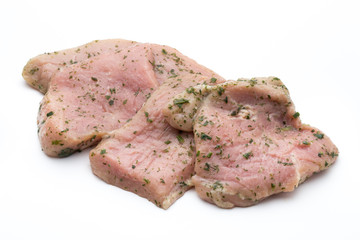 Steak with spices isolated on white background.