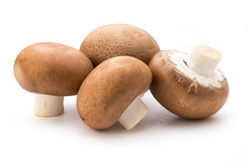 Fresh champignon mushrooms isolated on white.