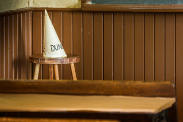 Dunce hat in an old school class.
