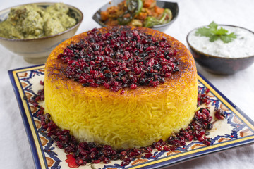 Traditional Rice Pie with Berberis and Curry as close-up on a table