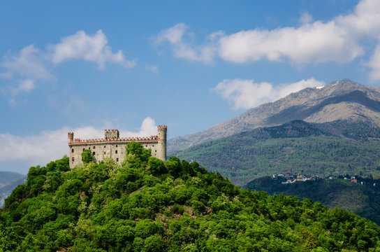 Castle of Montaldo Dora, in Canavese (Piedmont, Italy) with Alps on the background