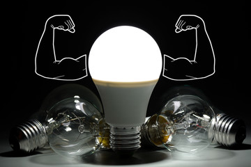 Led light bulb with inflated arms and lay next to incandescent bulbs in the dark