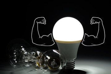 Led light bulb with inflated arms and lay next to incandescent bulbs in the dark