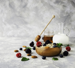 Healthy breakfast with oat flakes, raspberry berries, blueberries, selective focus