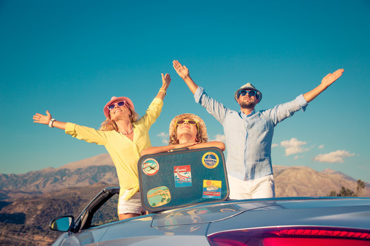 Happy family travel by car in the mountains