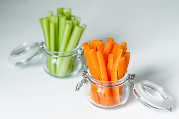 Healthy diet food. Carrots and celery chopped with chopsticks.