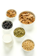 Healthy food. Milk, multi grain flakes and nuts for breakfast.