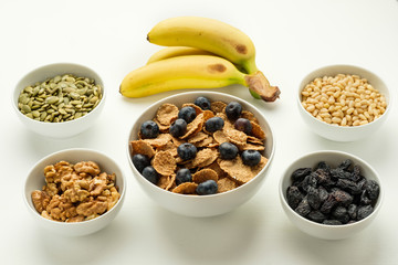 Healthy food. Multi grain flakes, nuts and bananas for breakfast.